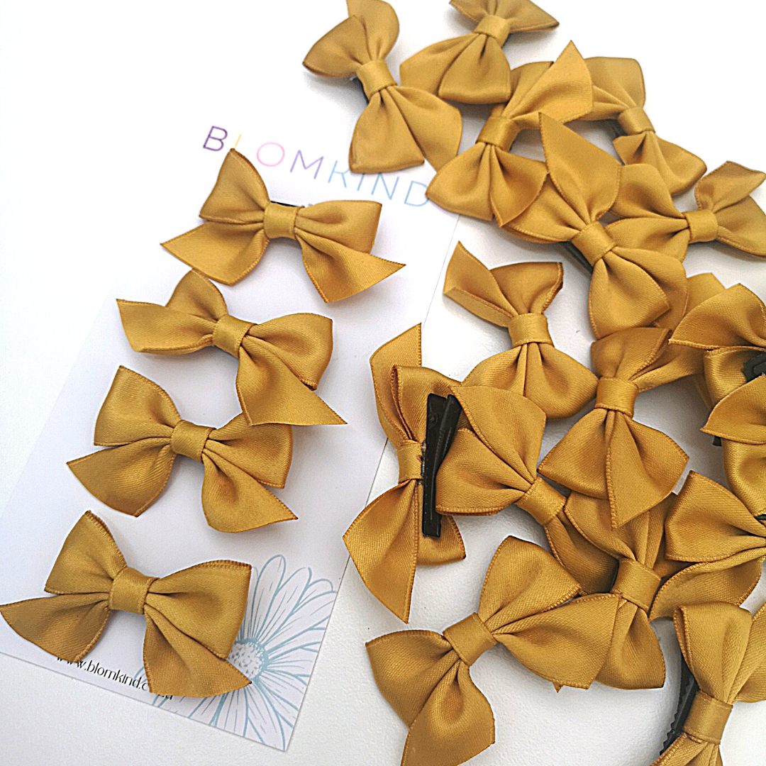 Gold Bow Hairclip Set of 4. Perfect for school.