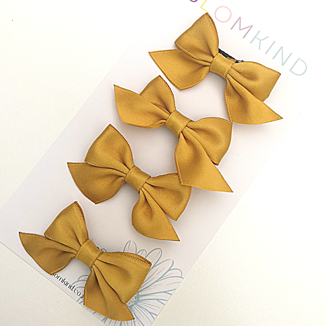 Gold Bow Hairclip Set of 4. Perfect for school.