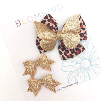 1 x Large Leopard print Bow.  2 x Small Gold Glitter Bow hairclips.